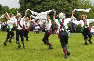 Crook Morris dancing a Cotswold dance with waving white handkerchiefs